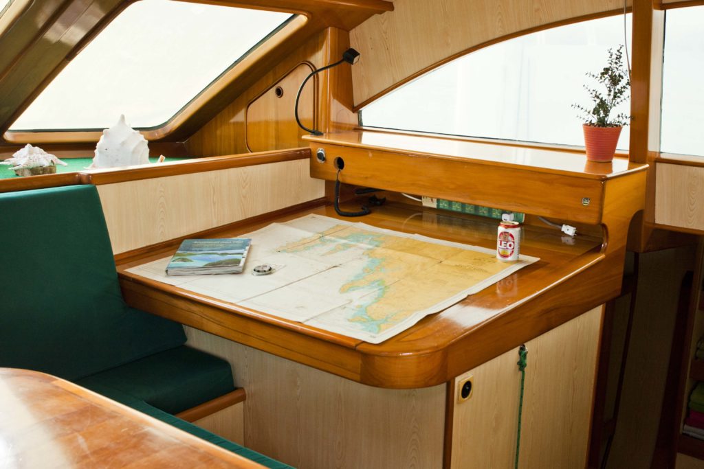 Chart table on Mahayana - cruising charter catamaran in Phuket